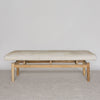 front view of the light colored hair on hide bench ottoman by corcovado designs