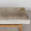 close up view of the light colored hair on hide bench ottoman by corcovado designs