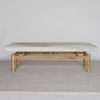 front view of the gray and cream colored bench ottoman