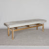 angled view of the gray and cream colored bench ottoman