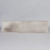 Hide bench seat in cream and earthy tones by Corcovado Design