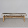 Hide bench seat in cream and earthy ones by Corcovado Design