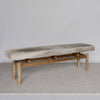 angled view of the Hide bench seat in cream and earthy tones by Corcovado Design