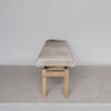 end view of the Hide bench seat in cream and earthy tones by Corcovado Design