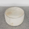 top view of the hair on hide light colored cowhide ottoman