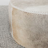 dark gray and brown colored hair on hide round ottoman coffee table