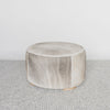 dark gray and brown colored hair on hide round ottoman coffee table