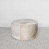 dark gray and brown colored hair on hide round ottoman coffee table