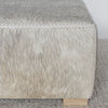 square hide ottoman with gray and caramel tones