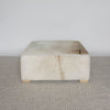 caramel brown and creamy colored square hide ottoman coffee table