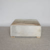 caramel brown and creamy colored square hide ottoman coffee table