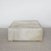 light creamy colored square hide ottoman coffee table