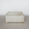 light creamy colored square hide ottoman coffee table