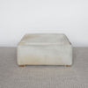 light creamy colored square hide ottoman coffee table