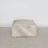 square cowhide coffee table ottoman in earthy tones and gray by corcovado design