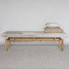 wide gray and cream colored cowhide bench seat from corcovado with 2 cushions on top