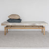 front view of an earthy toned cowhide bench seat ottoman from corcovado designs