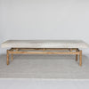 front view of a light colored cowhide ottoman bench seat from corcovado designs