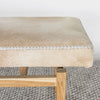 detailed close up of he caramel cream colored cowhide bench seat by Corcovado