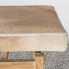 close up shot of the leather stitching on he caramel cream colored cowhide bench seat by Corcovado