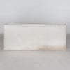 full front view of  an earthy cream colored cowhide bench seat from corcovado