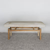 front view of a cream colored light cowhide ottoman bench seat from Corcovado Designs