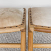 close up pair of two hide benches in caramel hide