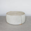 extra large cowhide round ottoman in light colored tones