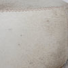 light cream and caramel colored hide ottoman coffee table by corcovado design