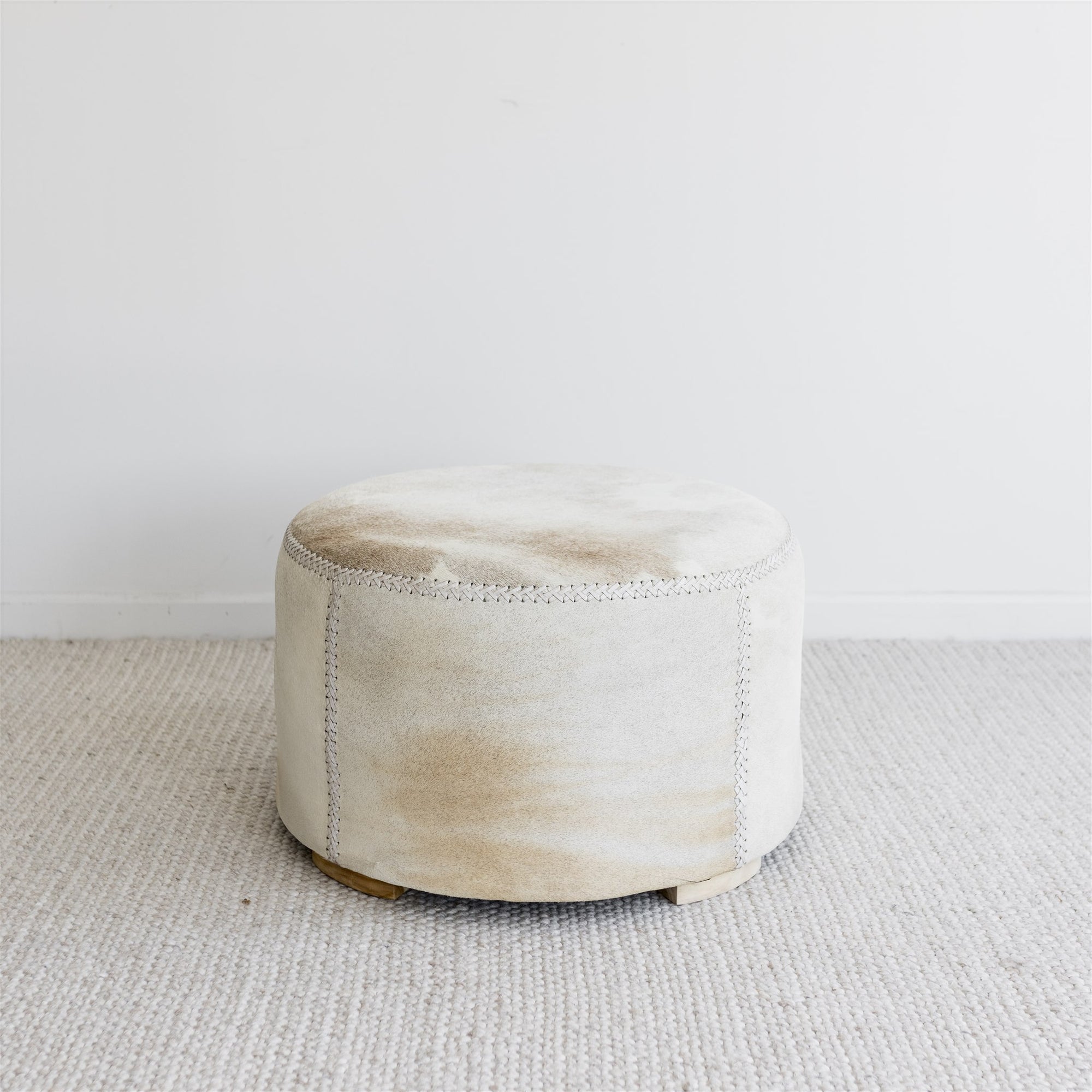 brown and cream round cowhide ottoman coffee table 