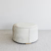 side view of the creamy light toned cowhide ottoman coffee table