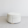 side view of the creamy light toned cowhide ottoman coffee table