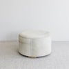 side view of the creamy light toned cowhide ottoman coffee table