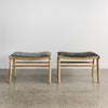 set of two green velvet stools with wood base side by side