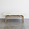 front view of the light coloured cowhide bench seat from corcovado