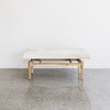 cream colored cowhide bench seat