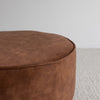 top down detail of the  low, round velvet ottoman in a cinnamon color from corcovado