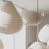 cluster of linen hanging light shades in natural and white