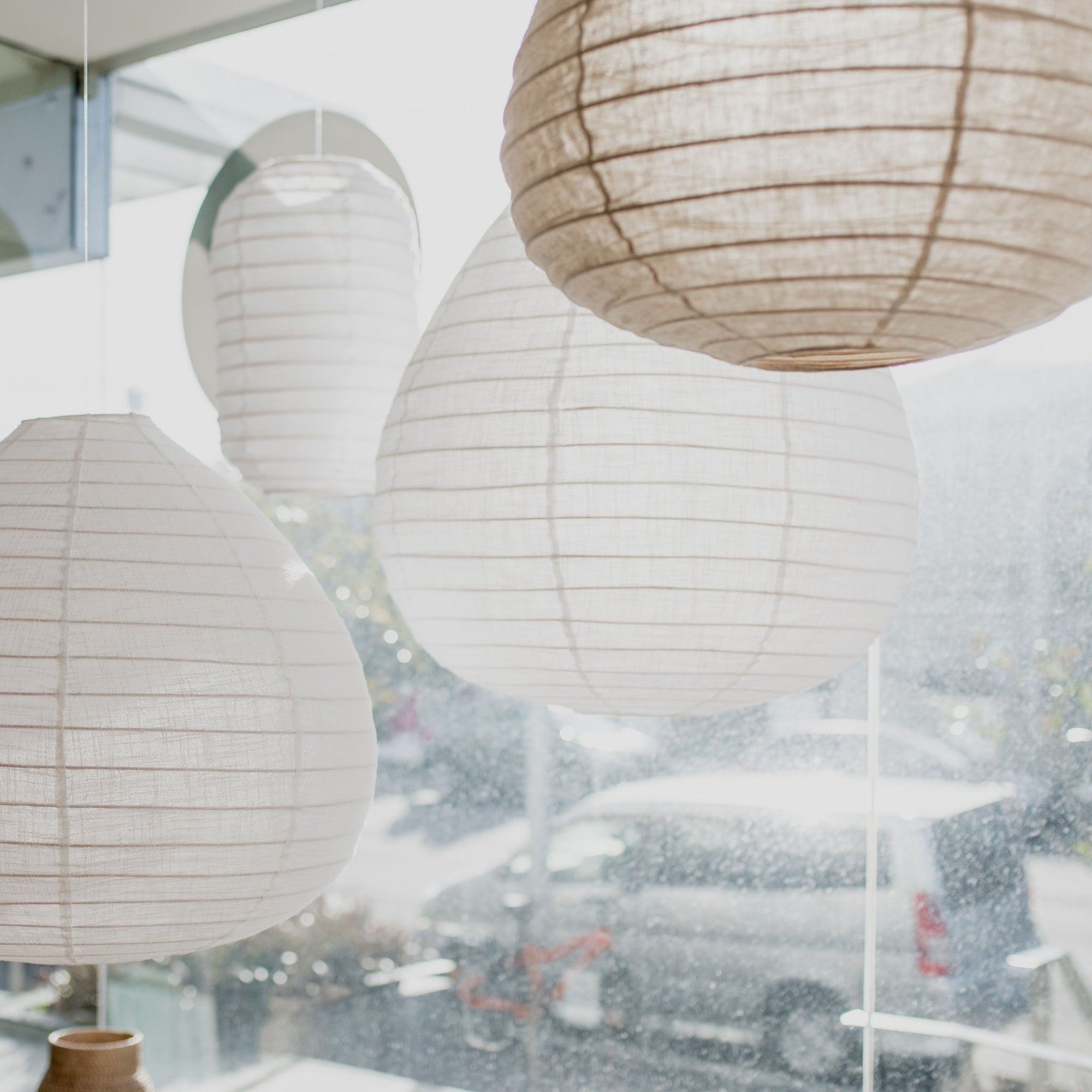 cluster of hanging linen pendant light shades from corcovado 