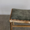 close up of jade green velvet small bench stool for vanity area or end of bed bench